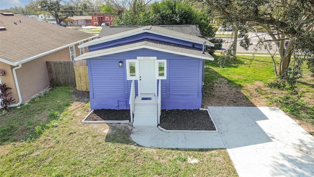 view of outbuilding with a yard