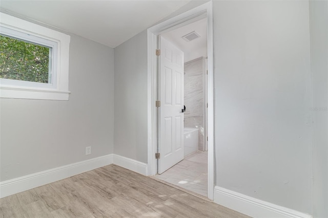 unfurnished room featuring light wood-type flooring