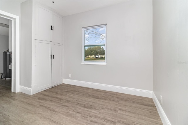 unfurnished bedroom featuring light wood-type flooring