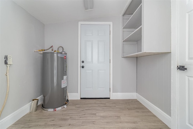 utility room with water heater