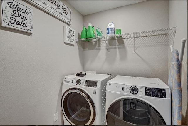 laundry room with washer and dryer