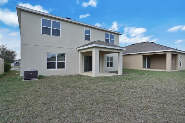 back of property featuring a patio, a yard, and cooling unit