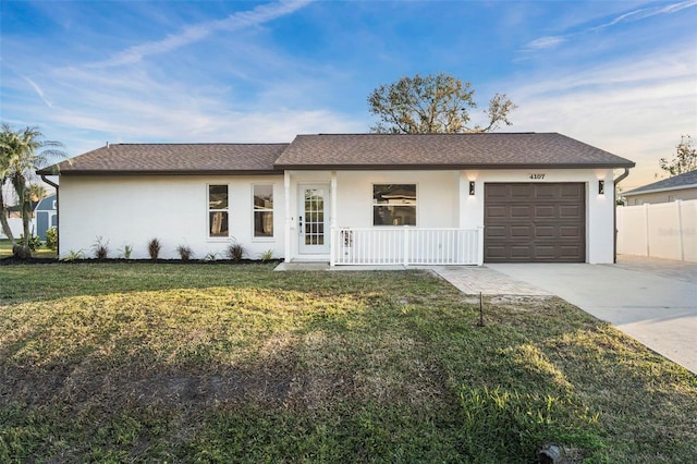 single story home featuring a garage and a front lawn