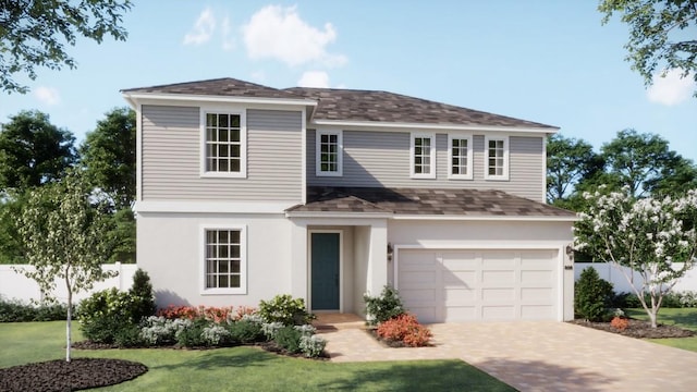 view of property with a garage and a front yard