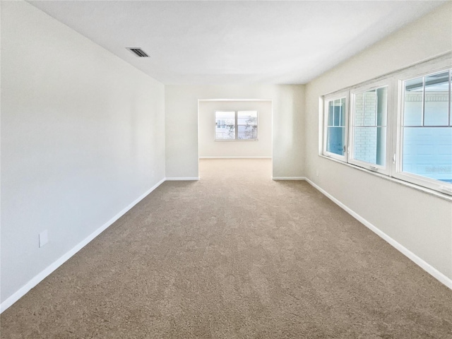 empty room featuring carpet floors