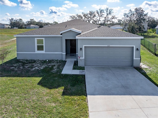 ranch-style house with a garage and a front yard