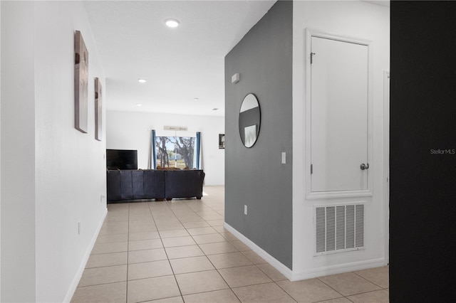 hallway featuring light tile patterned floors