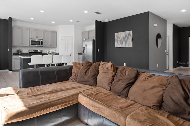 living room with light tile patterned floors