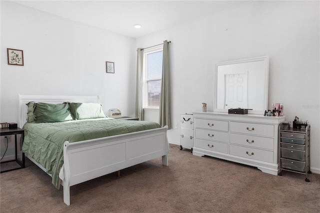 bedroom with dark carpet