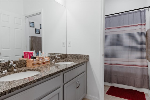 bathroom featuring a shower with curtain, tile patterned floors, and vanity