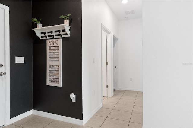 hallway featuring light tile patterned floors