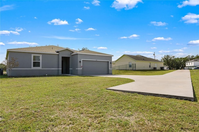 view of front facade with a garage and a front lawn