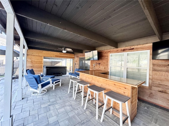 view of patio / terrace with an outdoor bar and ceiling fan