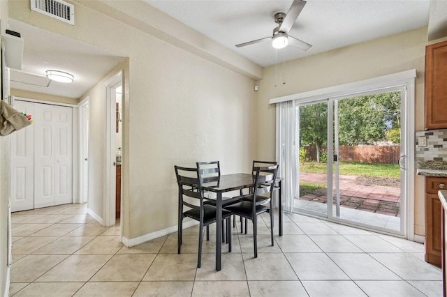 dining room with light tile patterned floors and ceiling fan