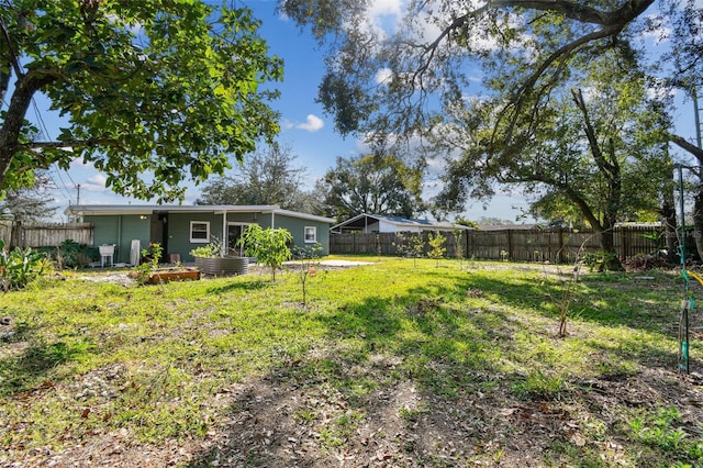 view of yard featuring a fenced backyard