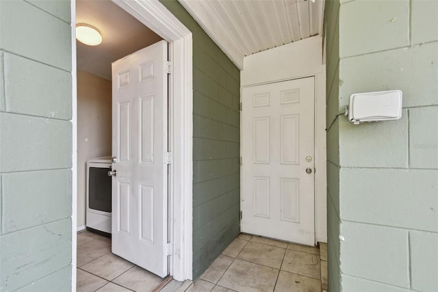 view of exterior entry with washer / dryer