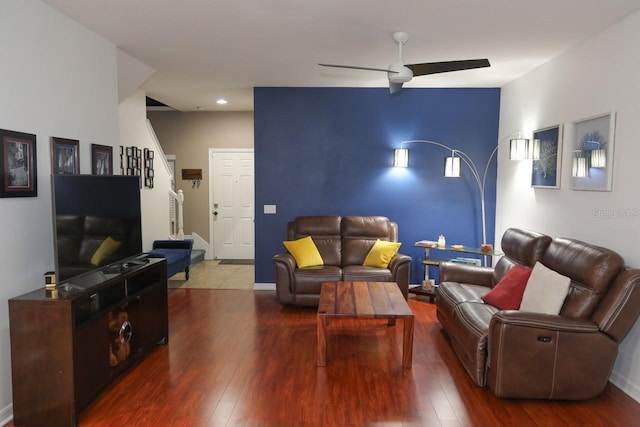 living room with hardwood / wood-style flooring and ceiling fan