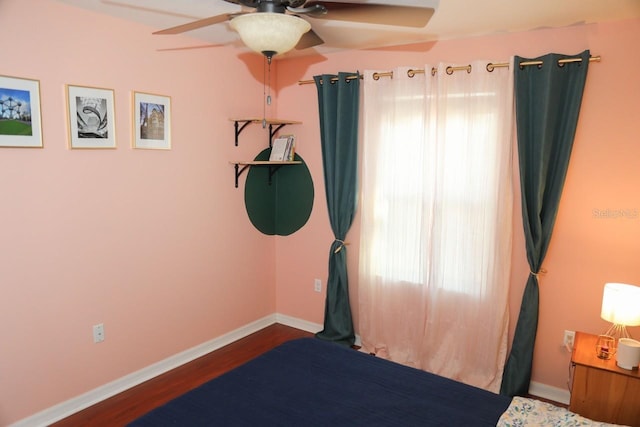 bedroom featuring ceiling fan and dark hardwood / wood-style flooring