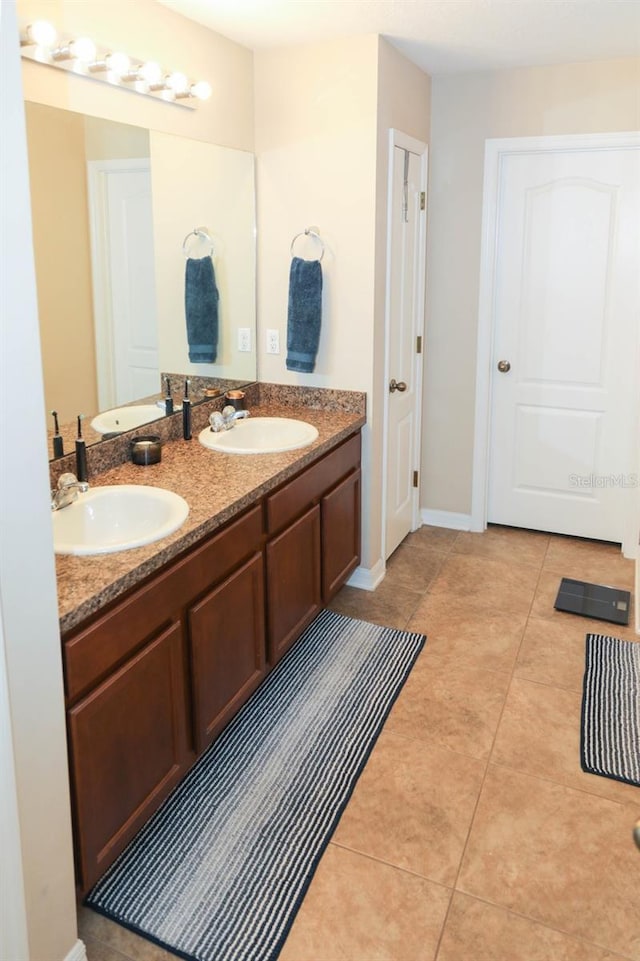 bathroom with tile patterned flooring and vanity