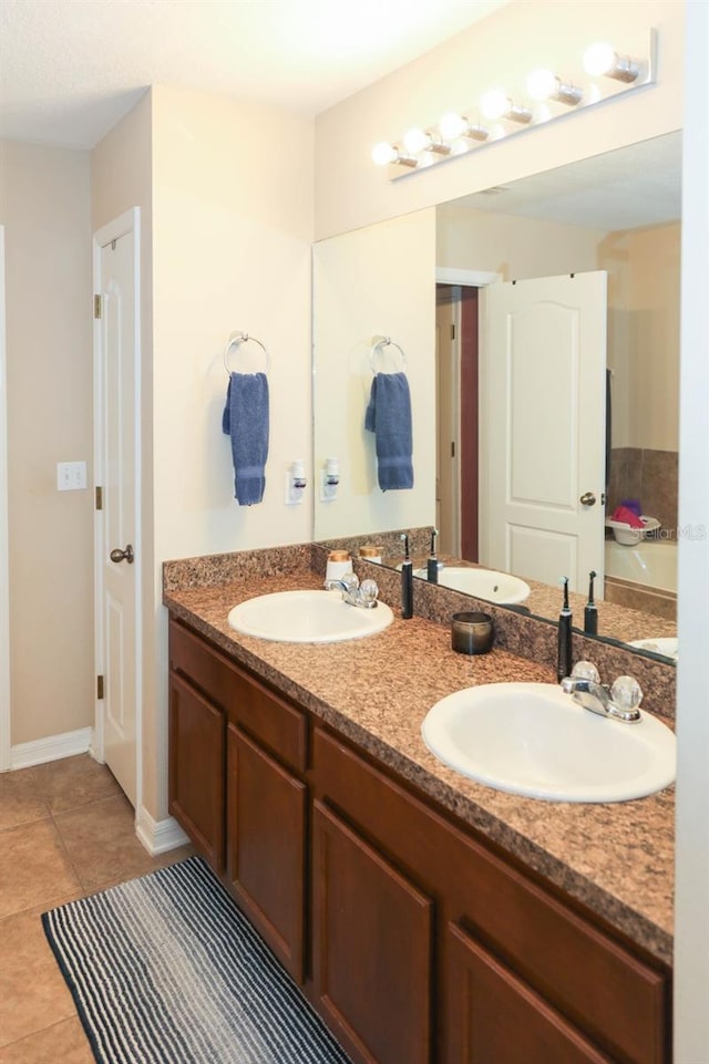 bathroom with vanity and tile patterned floors