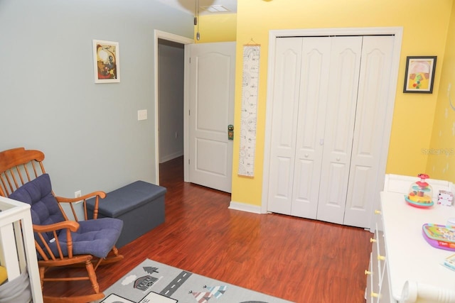 sitting room with dark hardwood / wood-style flooring