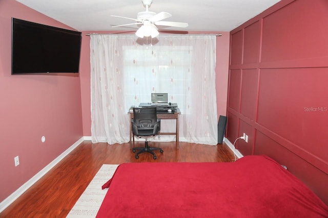 bedroom with ceiling fan and wood-type flooring