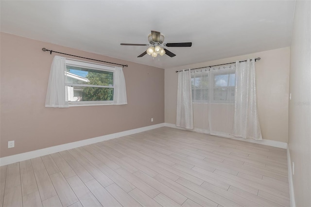 unfurnished room featuring ceiling fan and light wood-type flooring