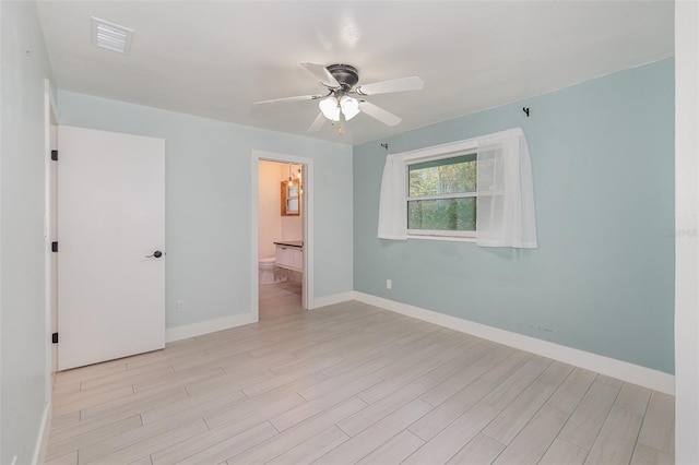 unfurnished room featuring ceiling fan and light hardwood / wood-style flooring