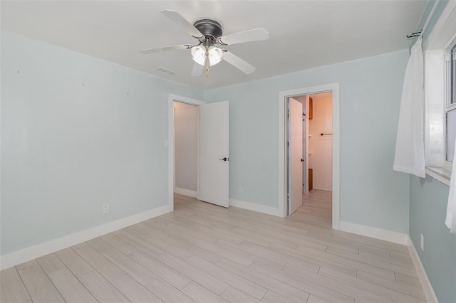 spare room featuring ceiling fan and light hardwood / wood-style flooring