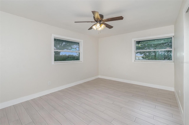 unfurnished room featuring ceiling fan and light hardwood / wood-style floors