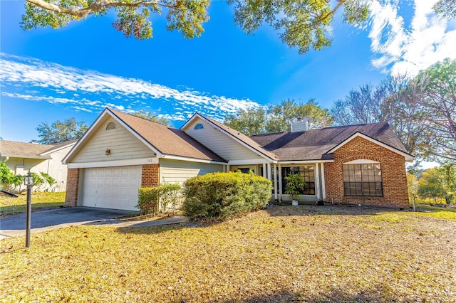 ranch-style home with a garage and a front lawn