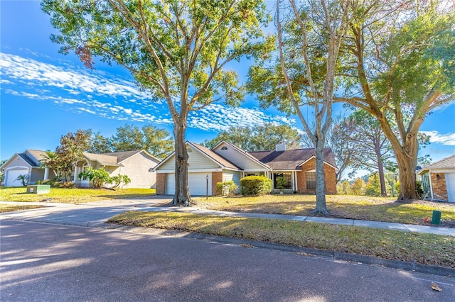 single story home with a garage and a front lawn