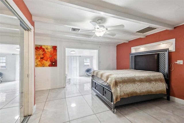 bedroom featuring beam ceiling, ceiling fan, and light tile patterned flooring