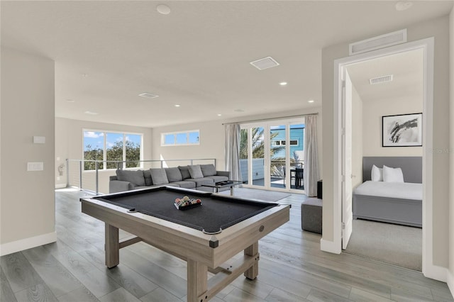 recreation room with billiards, light hardwood / wood-style flooring, and a wealth of natural light