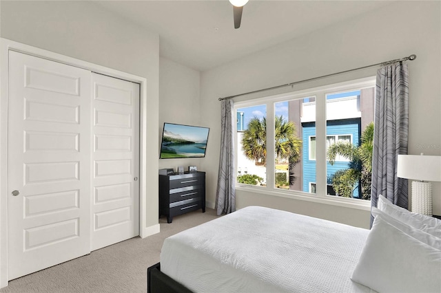 bedroom featuring light carpet and ceiling fan