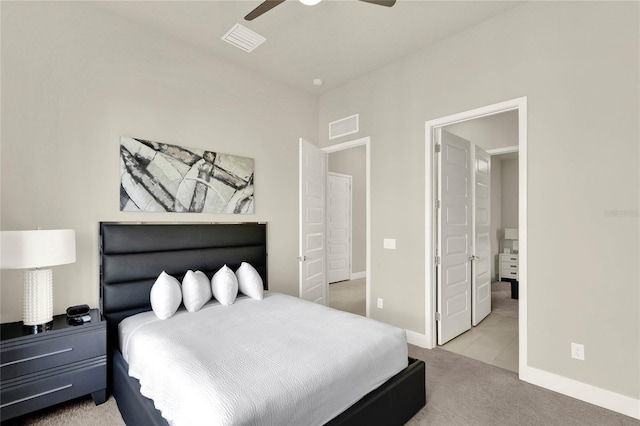 bedroom with light carpet and ceiling fan