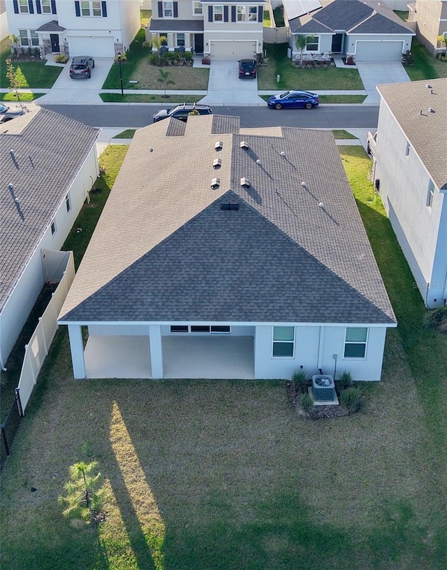 birds eye view of property with a residential view