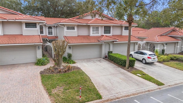 mediterranean / spanish-style house featuring a garage