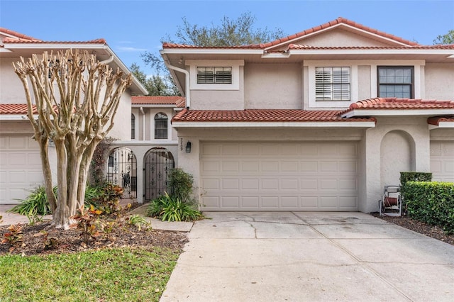 mediterranean / spanish-style home featuring a garage