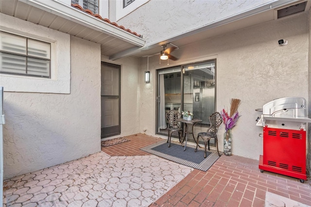 property entrance with a patio area