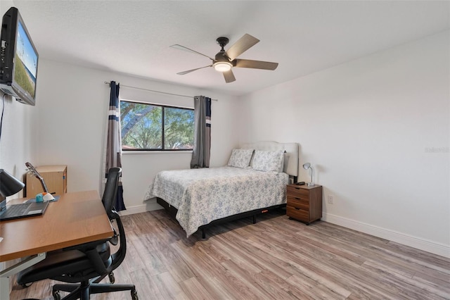 bedroom featuring ceiling fan and light wood-type flooring