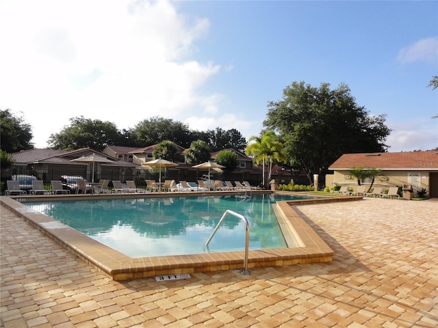 view of swimming pool featuring a patio