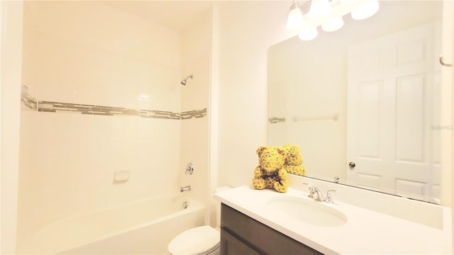 full bathroom featuring tiled shower / bath combo, vanity, and toilet