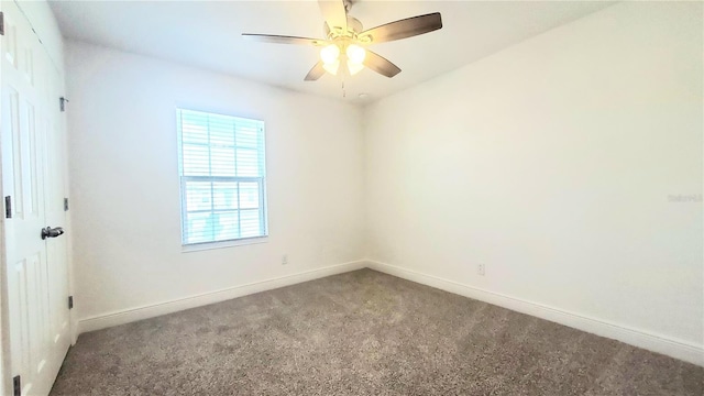 spare room with ceiling fan and carpet flooring