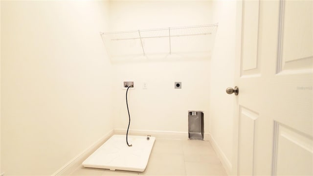 washroom featuring washer hookup, hookup for an electric dryer, and light tile patterned floors