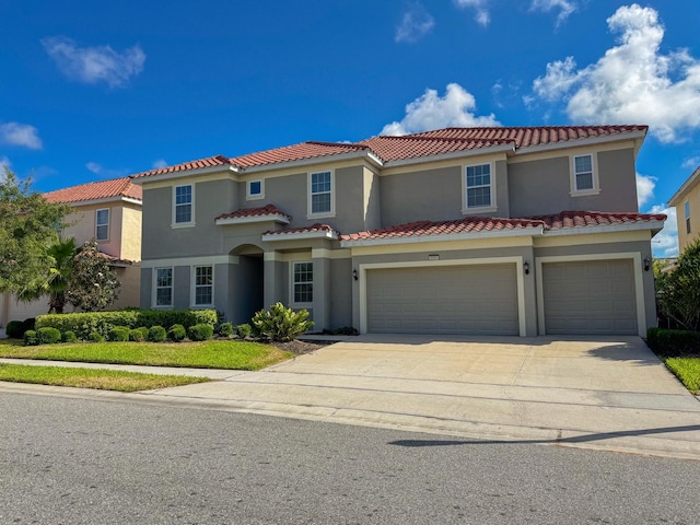 mediterranean / spanish-style house featuring a garage