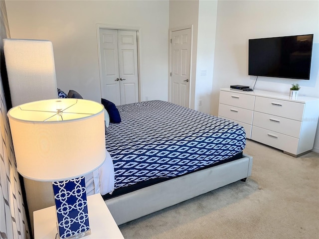 carpeted bedroom featuring a closet