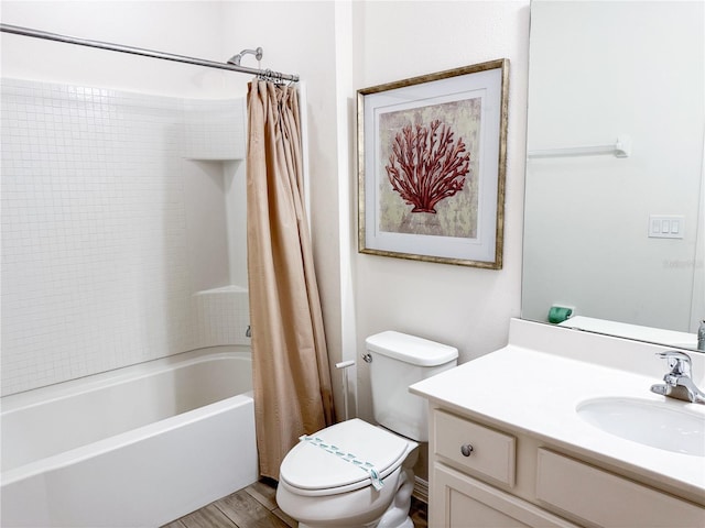 full bathroom with vanity, hardwood / wood-style floors, shower / bath combination with curtain, and toilet