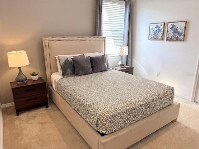 bedroom featuring light colored carpet