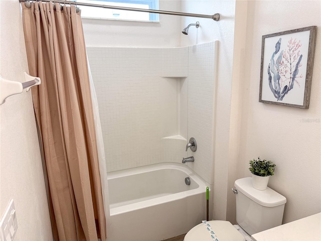 bathroom with shower / tub combo with curtain and toilet